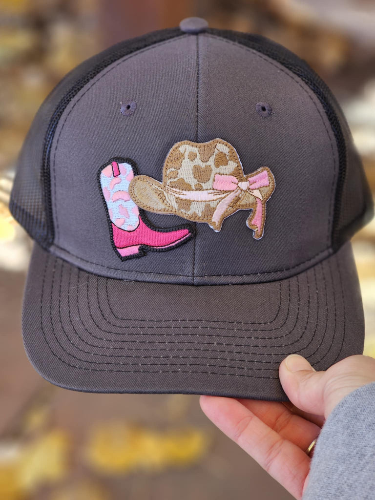 Pink Boot And Brown Cowgirl Hat Dark Grey And Black Trucker Hat patch trucker hat The Cinchy Cowgirl